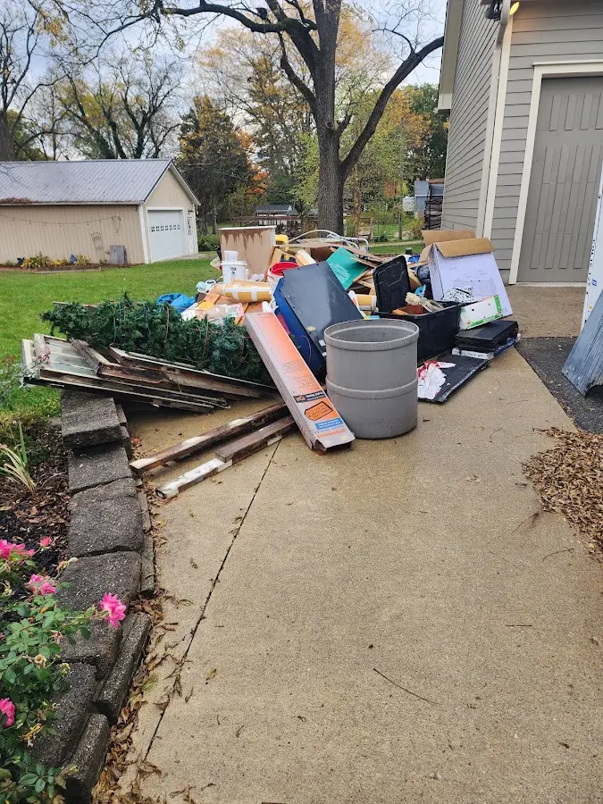 Dumpster being loaded with debris for Demolition Dumpster Rental in Anderson